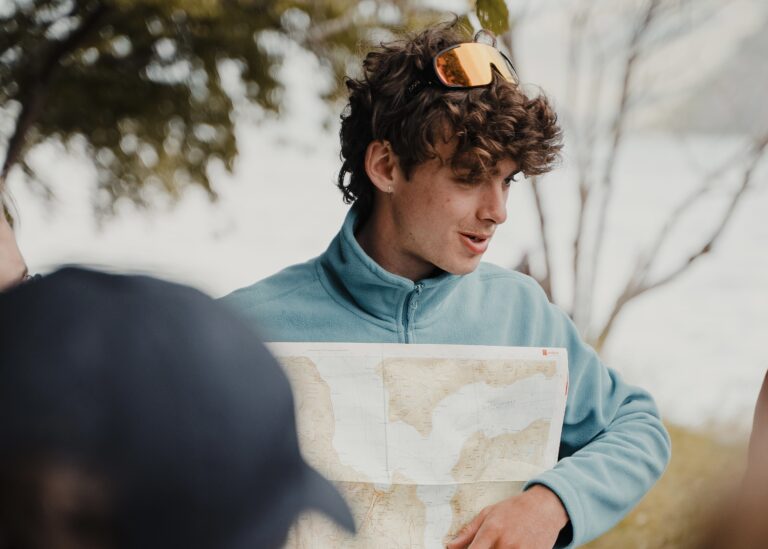 Man holding a map of Aurlandsfjord - Kayaking - Norway fjord - hiking in Norway - kayaking - from Brussels airport